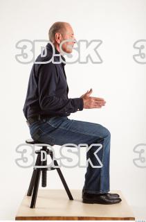 Sitting pose blue deep shirt jeans of Ed 0013
